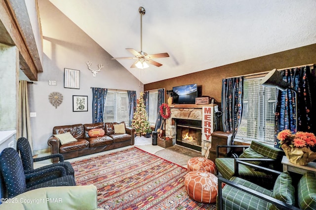 living area featuring a ceiling fan, carpet, high vaulted ceiling, and a stone fireplace