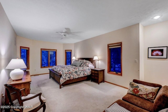 bedroom with carpet floors, ceiling fan, and baseboards