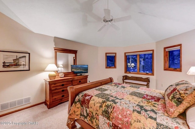 bedroom with a ceiling fan, visible vents, vaulted ceiling, baseboards, and carpet