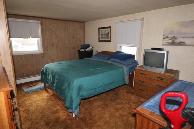 carpeted bedroom with baseboard heating