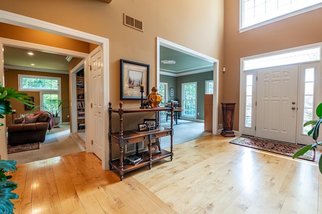 49 Central Dr, Easton, PA 18045 - entryway featuring hardwood / wood-style flooring, a towering ceiling, plenty of natural light, ornamental molding, and baseboards