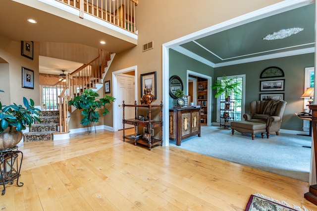49 Central Dr, Easton, PA 18045 - living area featuring stairway, baseboards, ceiling fan, hardwood / wood-style floors, and ornamental molding