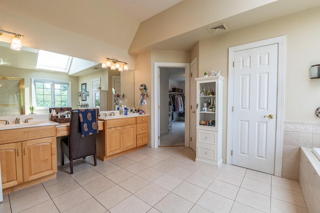49 Central Dr, Easton, PA 18045 - bathroom with tile patterned floors, vanity, a skylight, a stall shower, and vaulted ceiling