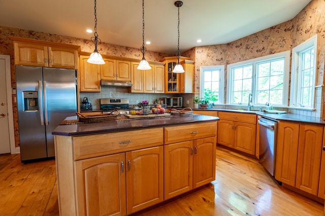 49 Central Dr, Easton, PA 18045 - kitchen featuring stainless steel appliances, under cabinet range hood, healthy amount of natural light, light wood finished floors, and wallpapered walls