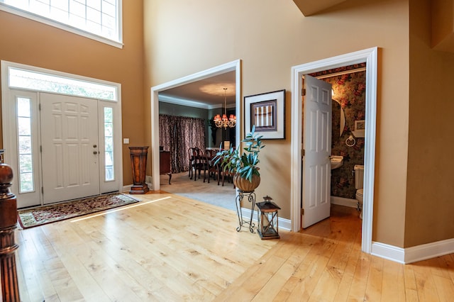 49 Central Dr, Easton, PA 18045 - foyer featuring a chandelier, hardwood / wood-style flooring, a towering ceiling, and baseboards