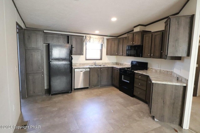 kitchen with light countertops, a sink, black appliances, and dark brown cabinets