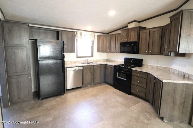 kitchen featuring crown molding, light countertops, a sink, dark brown cabinets, and black appliances