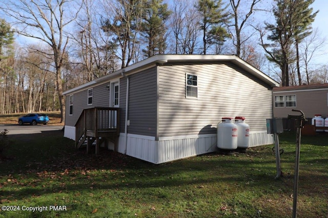 view of side of property with a yard