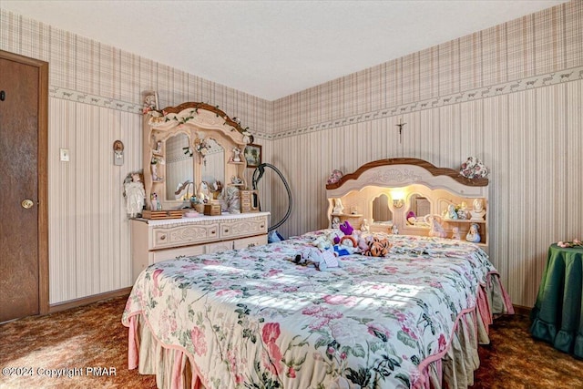 bedroom featuring wallpapered walls and baseboards