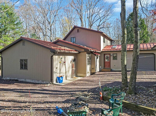 view of front of home featuring a garage and metal roof