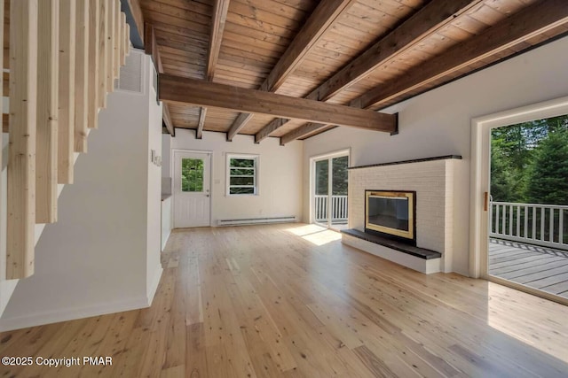 unfurnished living room featuring beamed ceiling, wood ceiling, baseboard heating, light hardwood / wood-style floors, and a brick fireplace