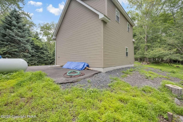 view of property exterior featuring a patio area