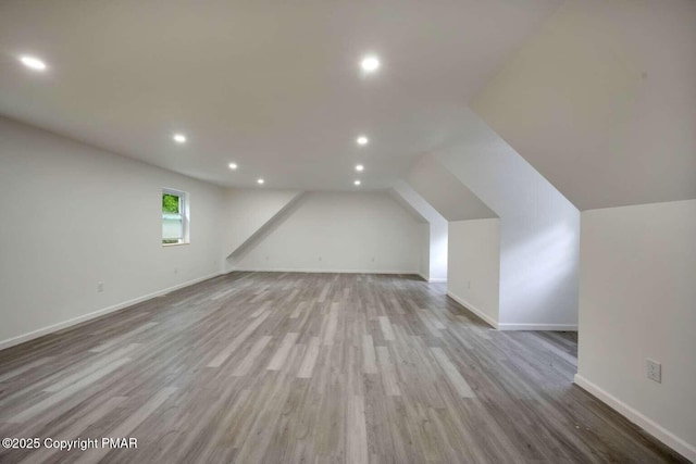 bonus room with light hardwood / wood-style floors