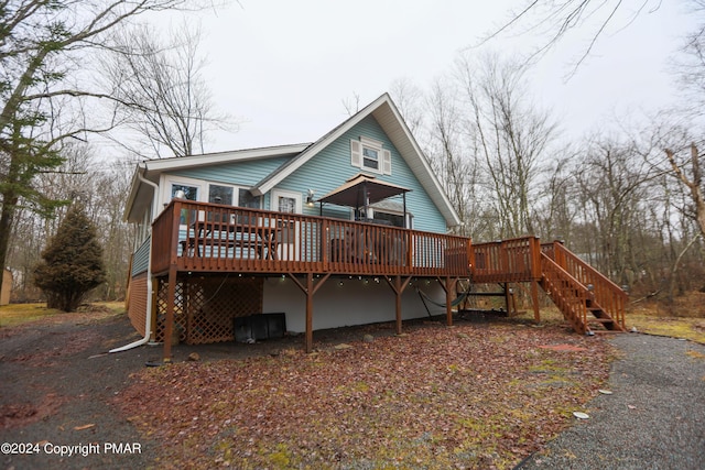 exterior space with stairway and a wooden deck