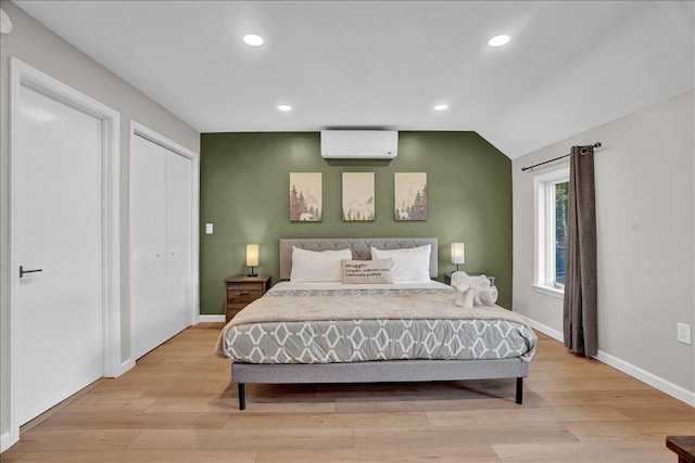 5266 Beechwood Rd, Blakeslee, PA 18610 - bedroom featuring recessed lighting, baseboards, a wall mounted AC, and light wood-type flooring