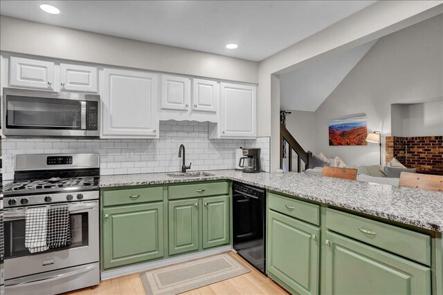 5266 Beechwood Rd, Blakeslee, PA 18610 - kitchen with stainless steel appliances, green cabinetry, a sink, and a peninsula