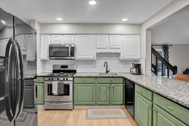 5266 Beechwood Rd, Blakeslee, PA 18610 - kitchen with a sink, white cabinets, black appliances, and green cabinets