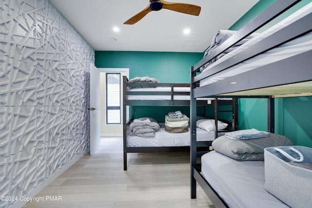 bedroom with recessed lighting, ceiling fan, and wood finished floors