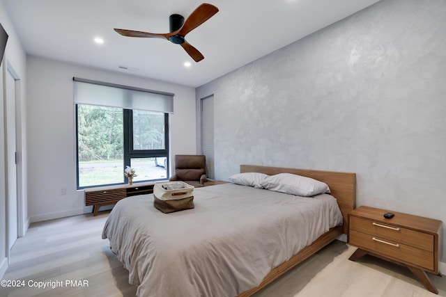 bedroom featuring recessed lighting, visible vents, light wood-style flooring, and baseboards