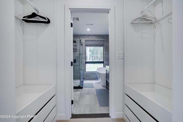 walk in closet featuring visible vents