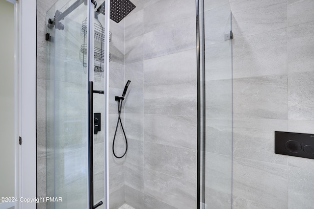 bathroom featuring a shower stall