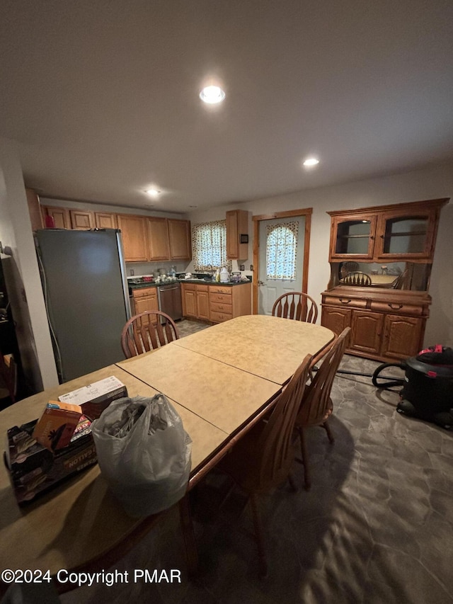 dining space featuring recessed lighting