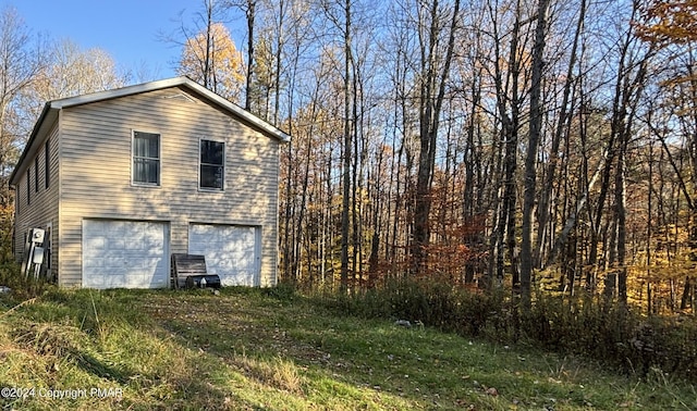 view of property exterior with a garage