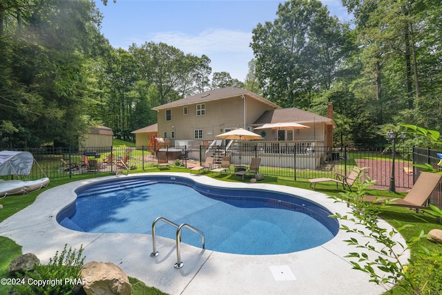 view of pool with a fenced in pool, a patio, and fence