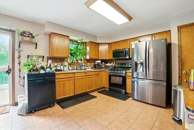 2602 Pocono Forested Dr, East Stroudsburg, PA 18302 - kitchen with appliances with stainless steel finishes, healthy amount of natural light, backsplash, and light countertops
