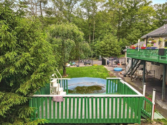 2602 Pocono Forested Dr, East Stroudsburg, PA 18302 - view of green lawn with stairway and a deck