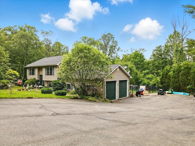 2602 Pocono Forested Dr, East Stroudsburg, PA 18302 - view of front facade featuring a garage and asphalt driveway