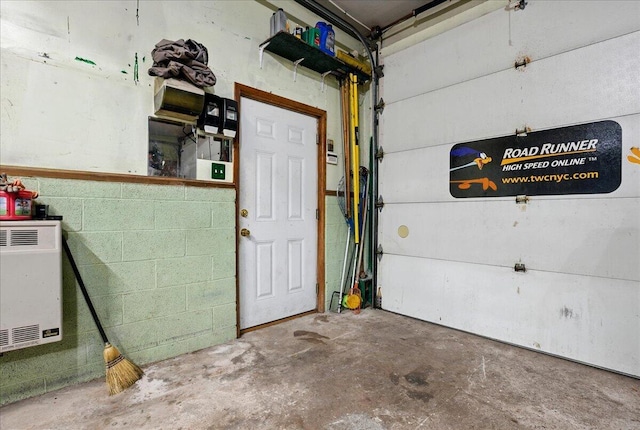 2602 Pocono Forested Dr, East Stroudsburg, PA 18302 - garage featuring concrete block wall and heating unit