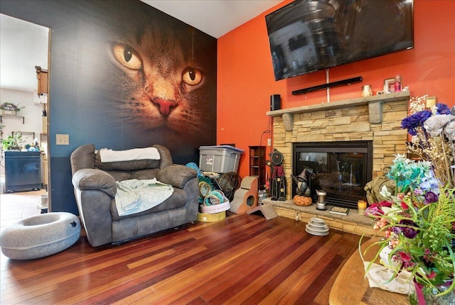 2602 Pocono Forested Dr, East Stroudsburg, PA 18302 - living area featuring wood finished floors and a stone fireplace