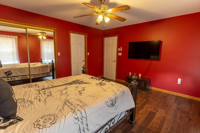 bedroom featuring ceiling fan, a closet, baseboards, and wood finished floors