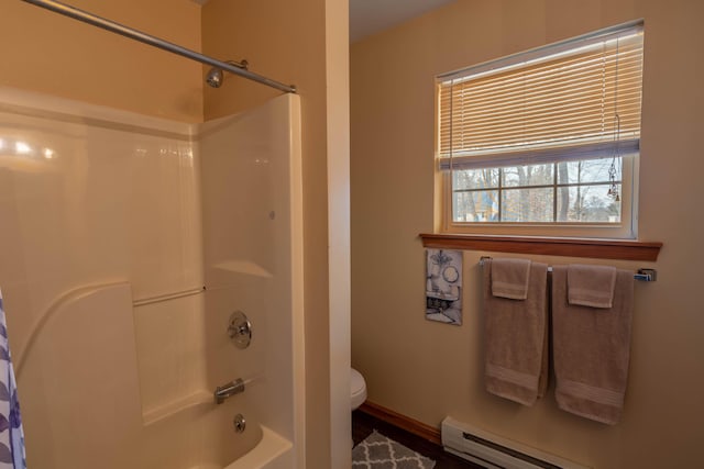 full bath with a baseboard heating unit, bathing tub / shower combination, toilet, and baseboards