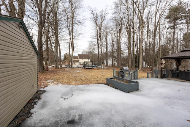 view of yard with a gazebo, a trampoline, and a patio area