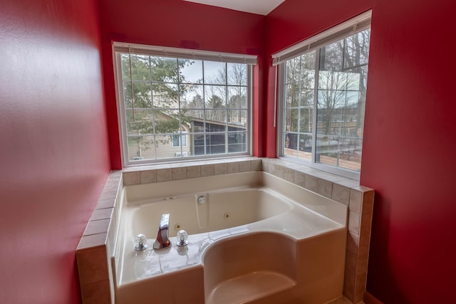 full bathroom with a jetted tub