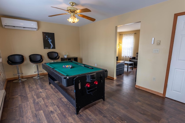 playroom with pool table, a baseboard heating unit, wood finished floors, a wall mounted air conditioner, and baseboards