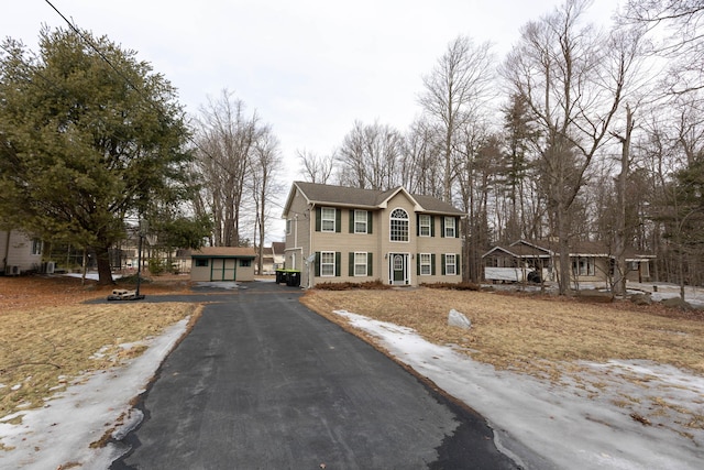 colonial-style house with an outbuilding