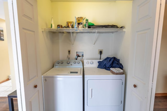 washroom with laundry area, dark wood finished floors, and washer and dryer