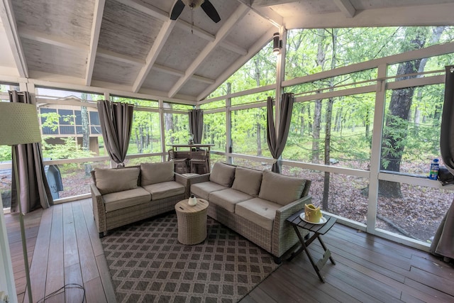 sunroom featuring an outdoor living space, a ceiling fan, vaulted ceiling, and plenty of natural light