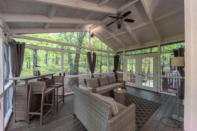sunroom with french doors, vaulted ceiling, a ceiling fan, and an outdoor living space