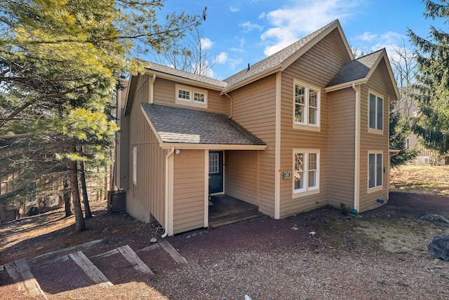 exterior space with a shingled roof