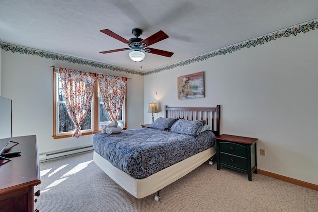 carpeted bedroom with a textured ceiling, baseboards, baseboard heating, and ceiling fan