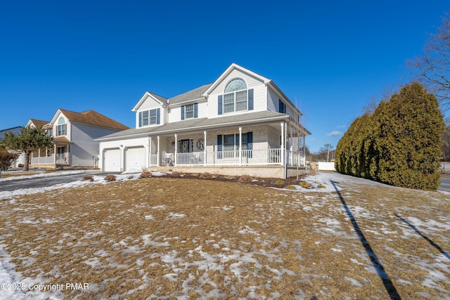 view of front of house with covered porch and driveway