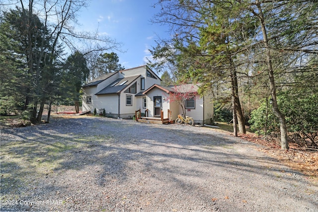 view of home's exterior featuring driveway