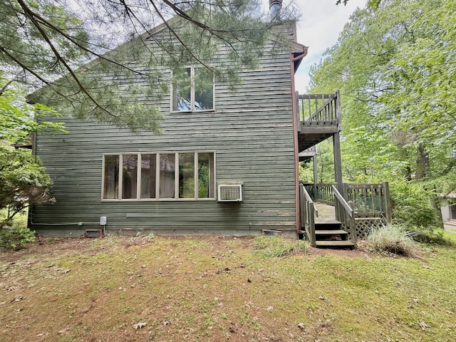 402 Shinymountain Ct, Greentown, PA 18426 - rear view of house with a wooden deck, a lawn, and a wall unit AC