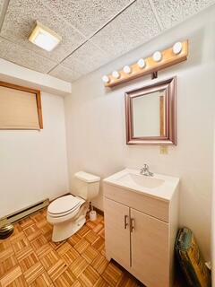 2383 Eagle Path, Bushkill, PA 18324 - half bathroom with vanity and baseboard heating