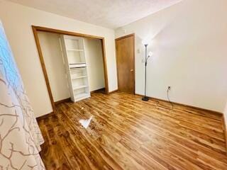 2383 Eagle Path, Bushkill, PA 18324 - unfurnished bedroom featuring wood finished floors and a closet