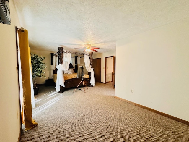 2383 Eagle Path, Bushkill, PA 18324 - bedroom featuring carpet, a textured ceiling, and a ceiling fan